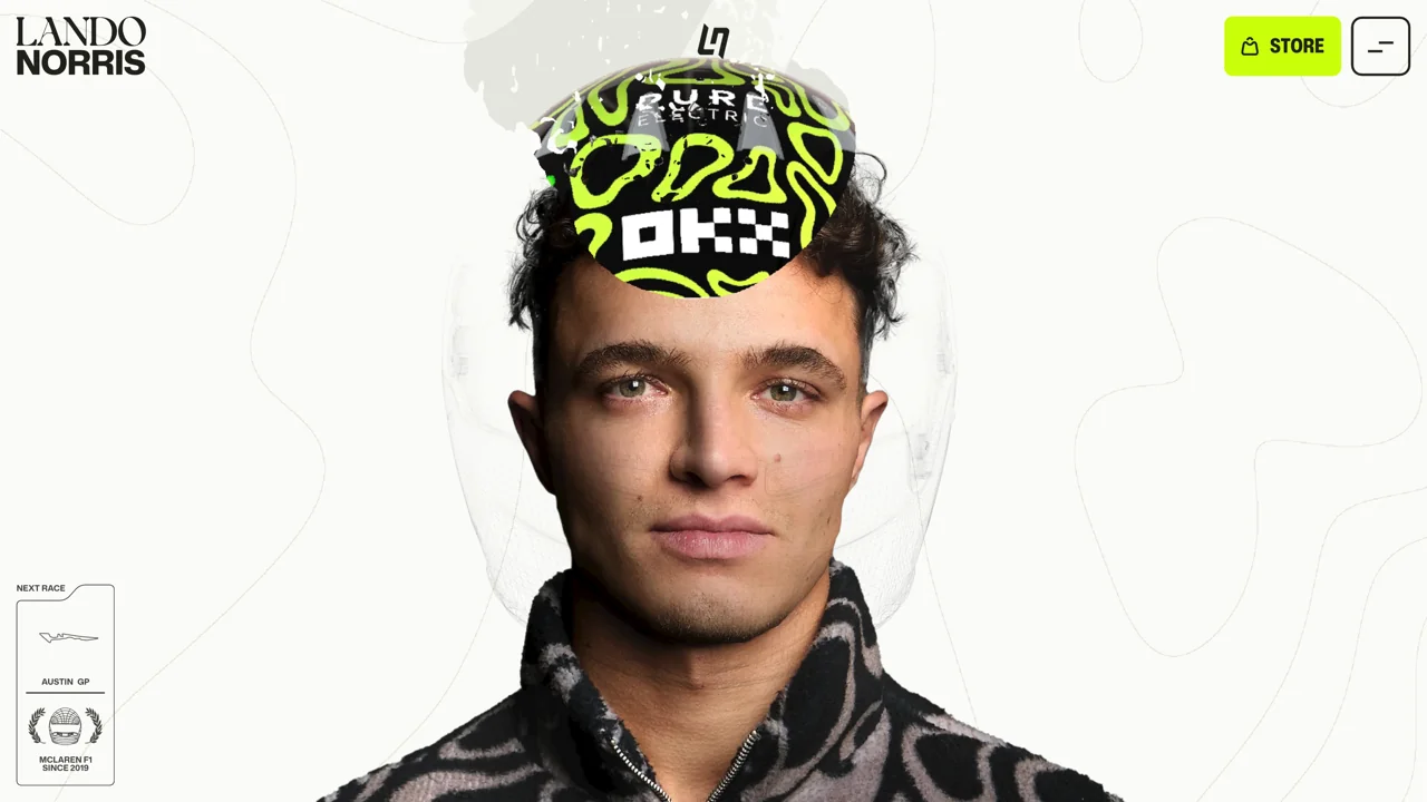 Schermata reale del sito di Lando Norris: il casco si sovrappone alla parte superiore del ritratto.